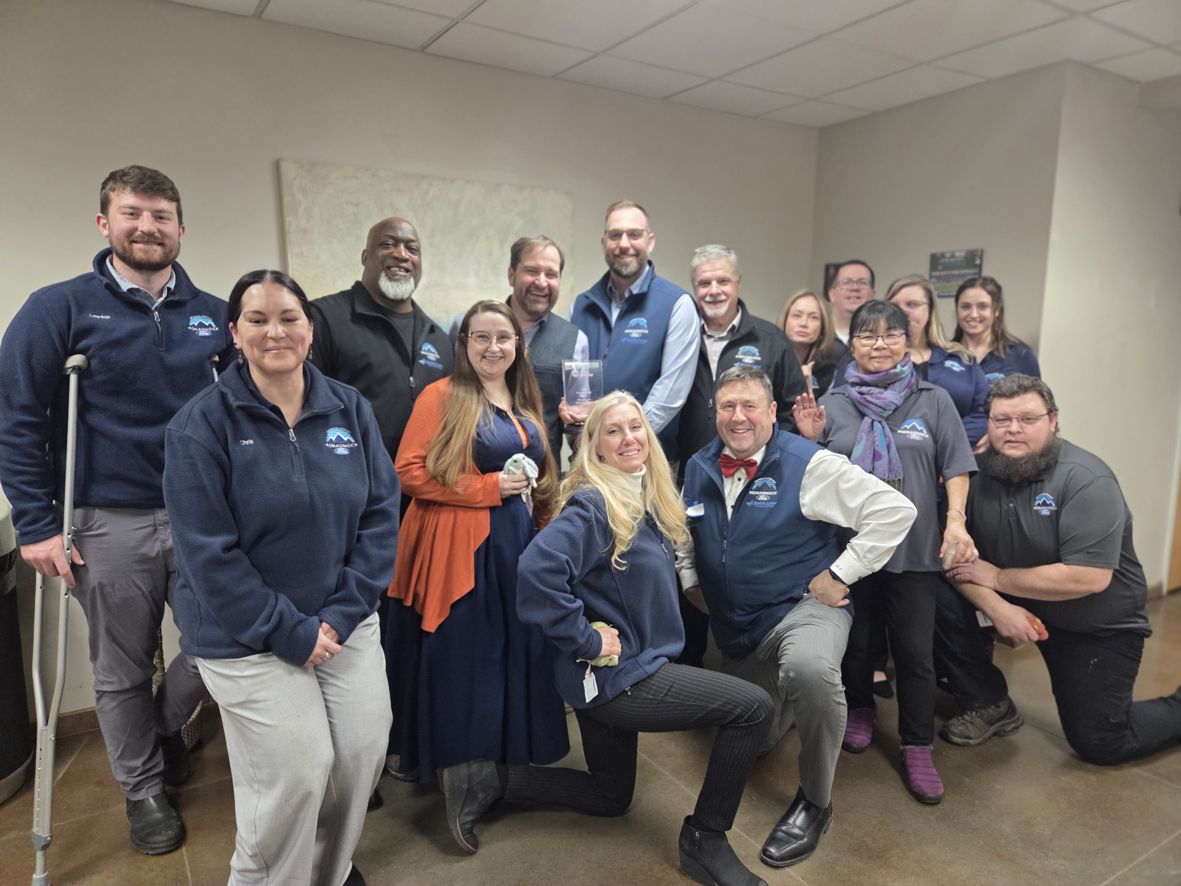 group picture of Monadnock Ford employees posing happily for the camera