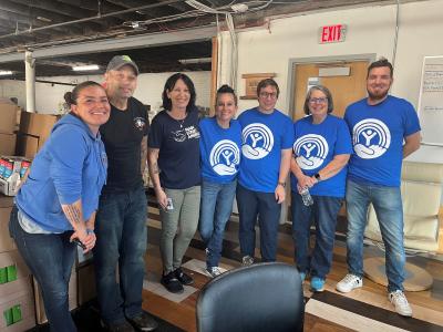 group of volunteers wearing blue shirts