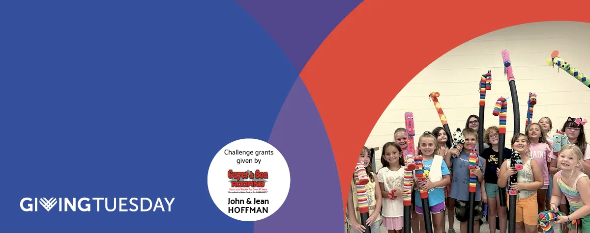 image of children with artwork celebrating GivingTuesday