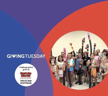 image of children with artwork celebrating GivingTuesday