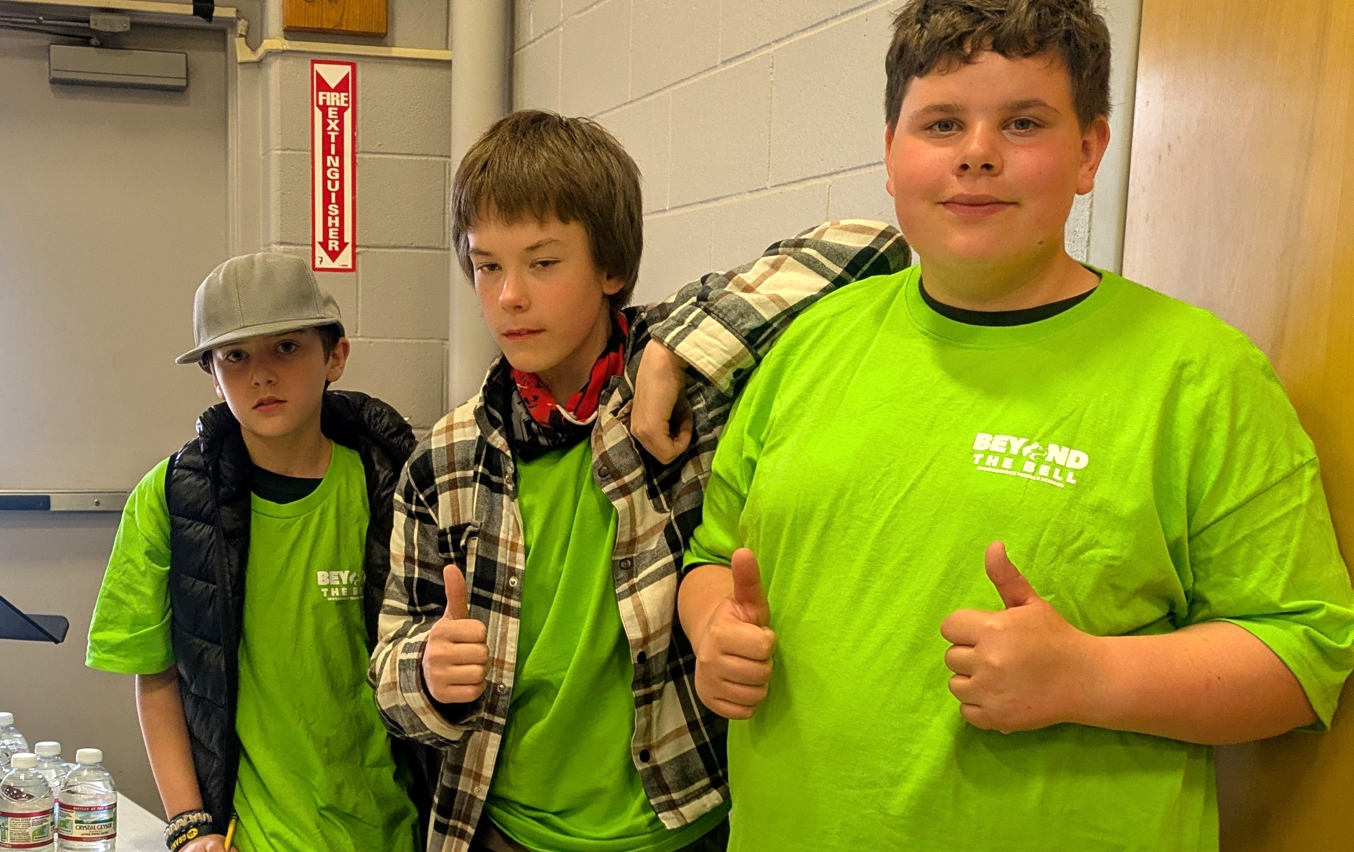 3 boys at beyond the bell snack table