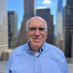 picture of Jock Wright with buildings in the background.